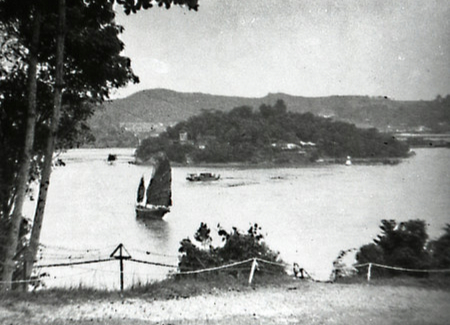 Pulau Ubin with small junk sailing by